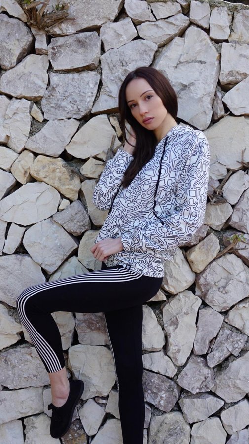 Customer wearing a Hoodie Lab all-over-print hoodie